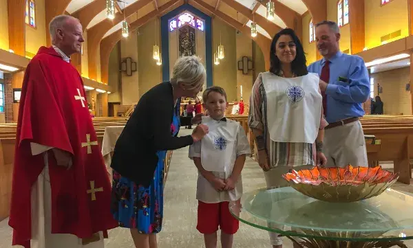 Two people becoming Catholic at the Easter vigil